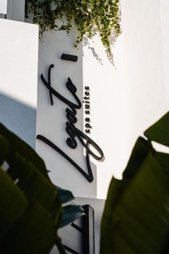 a sign that has two pairs of scissors on it at Legato Spa Suites With Private Pool in Naxos Chora