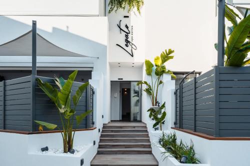a stairway leading to a building with plants at Legato Spa Suites With Private Pool in Naxos Chora