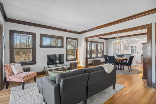 a living room with a couch and a tv at Garden Apt, Majestic MPLS Duplex in Minneapolis