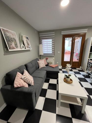 a living room with a couch and a table at Apartamento Victoria in Potes