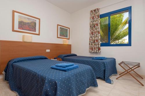 Villas Las Marinas tesisinde bir odada yatak veya yataklar