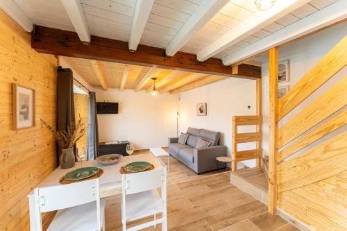 a living room with a table and a couch at encanto rural en arce by urbanhosting in Arce