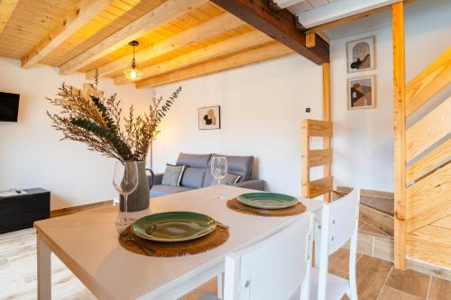 a kitchen and dining room with a table and chairs at encanto rural en arce by urbanhosting in Arce
