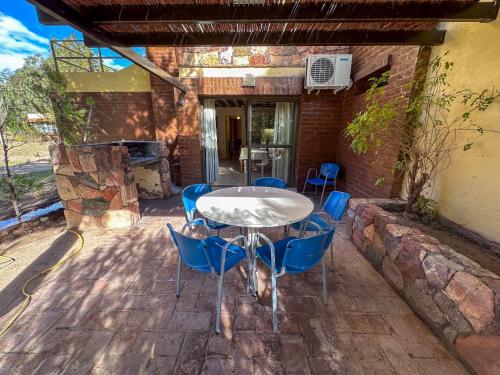 a table and chairs sitting on a patio at Cabañas Del Sol in Valle Grande