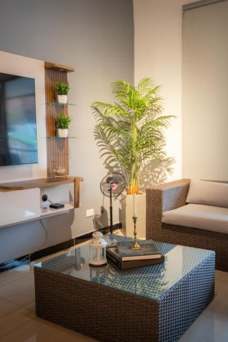 a living room with a table and a couch at 5STARHOMES - Estilo y confort en Laureles in Medellín