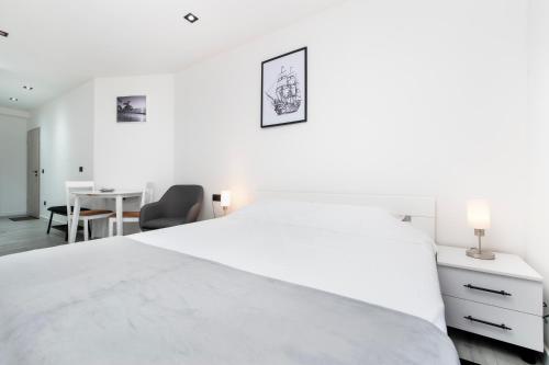 Ένα ή περισσότερα κρεβάτια σε δωμάτιο στο Apartments Volta See view