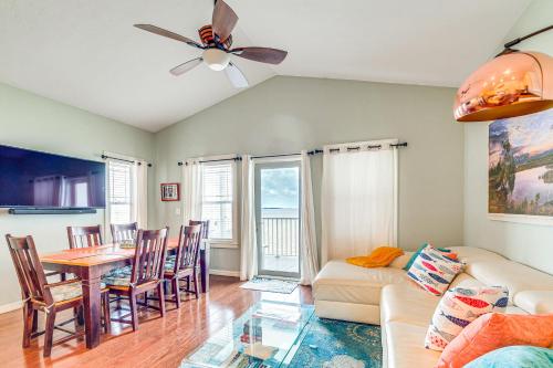 a living room with a couch and a table at Steps to Beach Waterfront Cedar Key Home! in Cedar Key