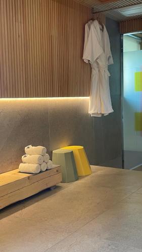 a room with a rack of towels and a dress hanging up at PBr7 Hotel Unusual Stay in Gyeongju