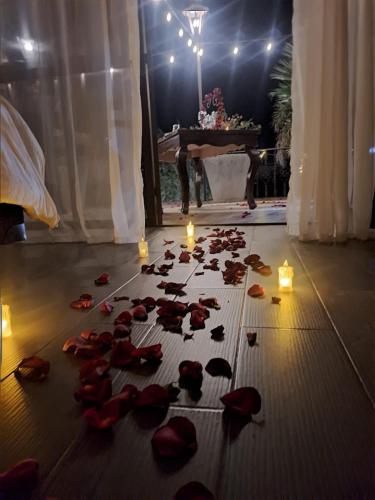 a bunch of rose petals on the floor with candles at SANTA CECILIA LA MORA HUASCA in Huasca de Ocampo
