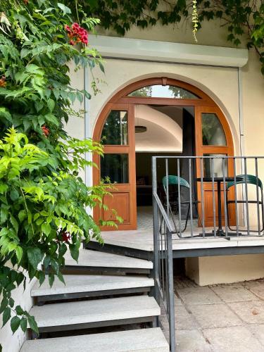 a staircase leading to a door of a house at Palác Daun - Studio Apartments in Znojmo