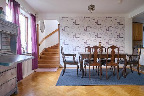 a dining room with a table and chairs at Harmony in Fleninge