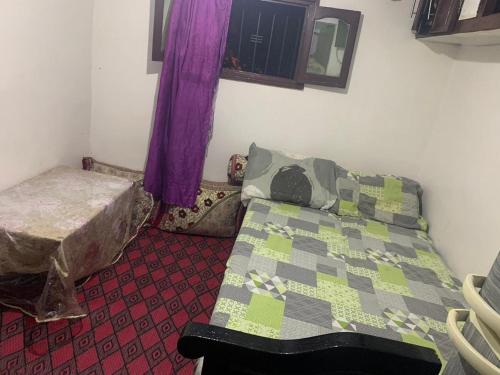 Un ou plusieurs lits dans un hébergement de l'établissement Chembre for rent à taghazout