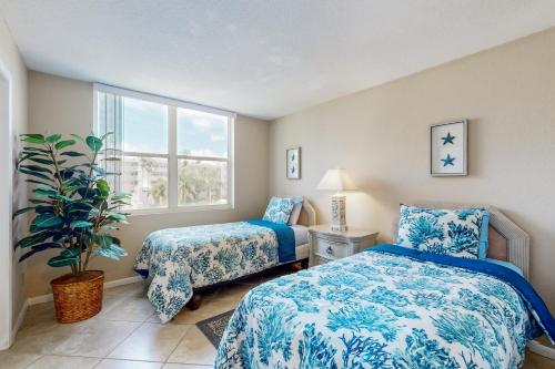 En eller flere senge i et værelse på Sunset Vistas