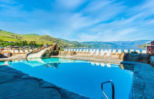 a swimming pool with a view of a body of water at Lake Chelan Executive Condo in Chelan