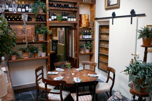 a dining room with a table and chairs at The Coach House in Roundwood