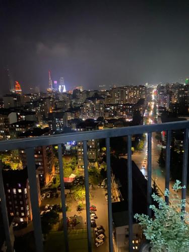a view of a city at night at Панорама-Батуми in Batumi