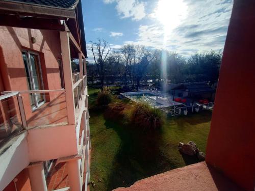 a view of a yard from a window of a house at Hotel El Sauce in Santa Rosa de Calamuchita