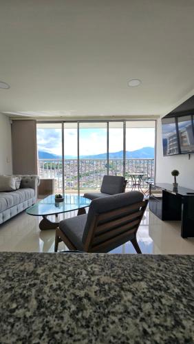 a living room with a couch and a table at Estadía Familiar in Ibagué