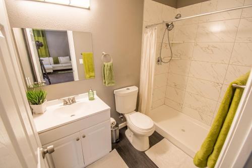 a bathroom with a toilet and a sink and a shower at Spacious 2-Bedroom Townhouse with Pool & Private Patio in Central Las Vegas in Las Vegas