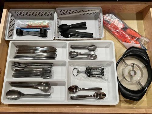 a white tray with utensils sitting on a table at The Bluejay Cabin at Munds Park, AZ! in Sedona
