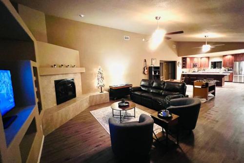 a living room with a couch and a fireplace at The Bluejay Cabin at Munds Park, AZ! in Sedona