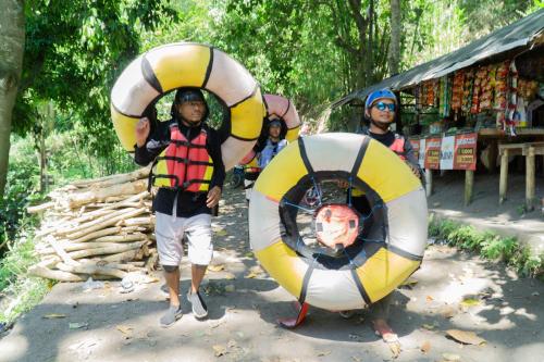 a boy is standing next to two at Aranka Tempasan in Sangyang