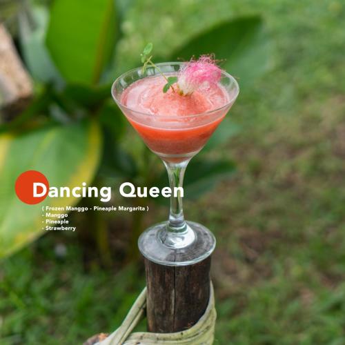 a drink in a glass with a strawberry in it at Aranka Tempasan in Sangyang