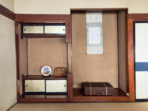 a room with two glass doors and a window at 小グループ専門貸切一軒家 パーティーOK観光スポット徒歩圏内 小諸駅歩2分揚羽屋 Specializing in small groups, Party OK, Walking to tourist spots, Vacation Rental House 2 min from Komoro sta in Komoro