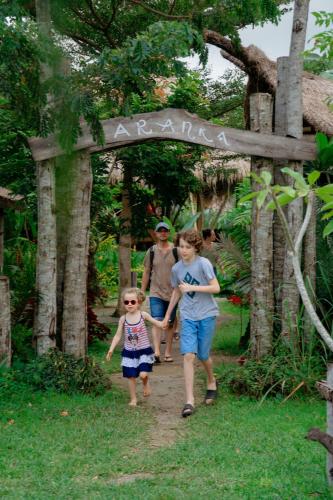 a group of people walking down a path at Aranka Tempasan in Sangyang