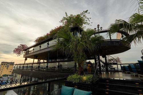 a building with plants on the side of it at La Siesta Premium Hang Be in Hanoi