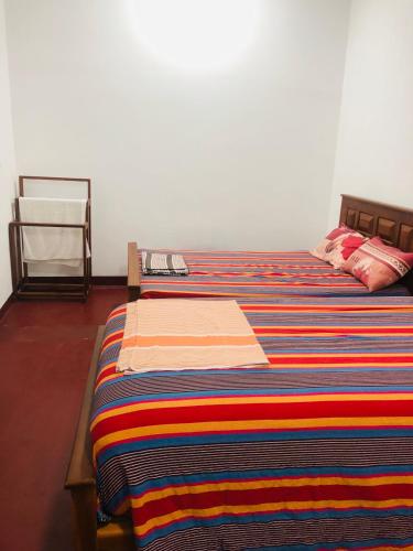Uthayam Guest Houseにあるベッド