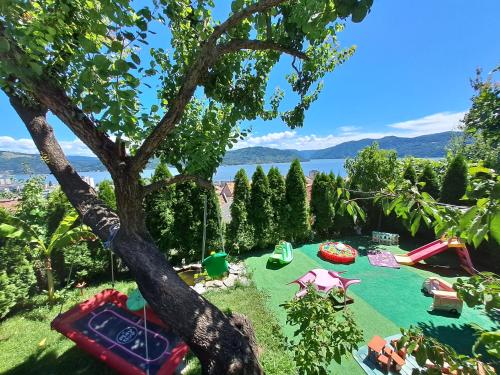 a view of a playground with a tree at Casa DucAna in Orşova
