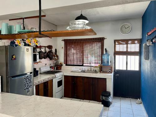 Kuchyň nebo kuchyňský kout v ubytování La casa del pescador