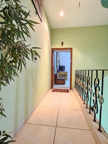 a hallway of a house with green walls at The Green Villa in Ludhiana