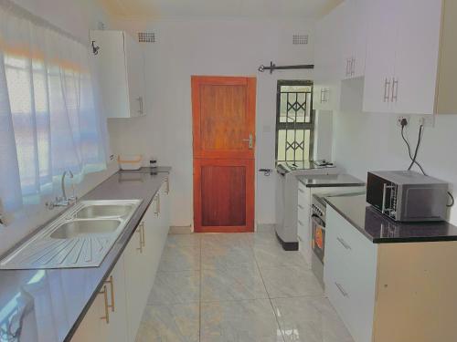 Kuchyň nebo kuchyňský kout v ubytování Coast Haven