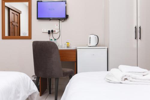 Giường trong phòng chung tại Homelike Guest house