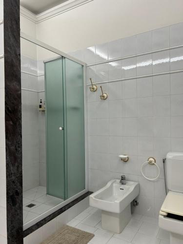 a bathroom with a shower and a toilet and a sink at Villa Ada in Monsummano