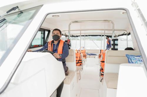 a man wearing a mask in a bus at Samed Tropical Resort in Ko Samed