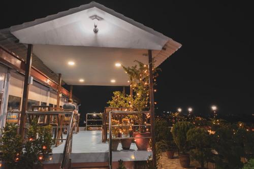 a white umbrella on a patio at night at Hotel Nepalaya in Kathmandu