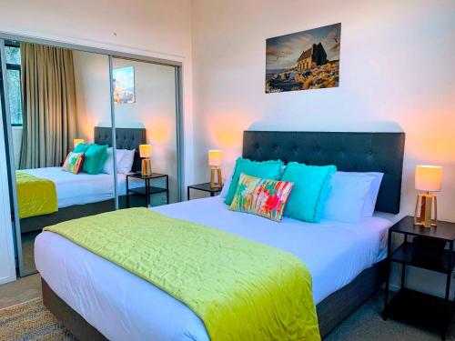 a hotel room with two beds and two lamps at @MyHolidays - My Remarkable view in Queenstown