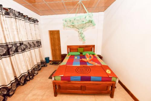 a bedroom with two beds in a room at Elephant Trio Sigiriya in Sigiriya