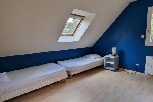 En eller flere senge i et værelse på BRETAGNE proche mer maison 5 chambres