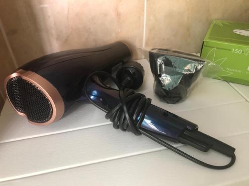 a hair dryer sitting on top of a counter at Mediterraneum in Bari