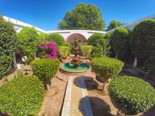 an aerial view of a garden with a fountain at Hacienda Santa Cruz Del Fuerte in El Fuerte