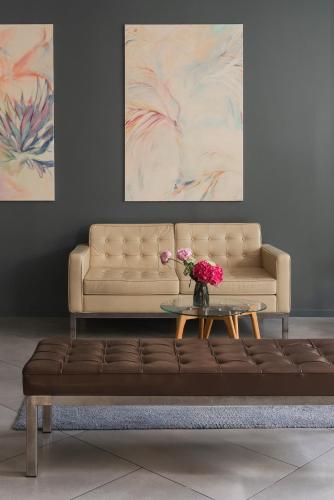 a living room with a couch and a table at Hotel Admiral Lugano in Lugano