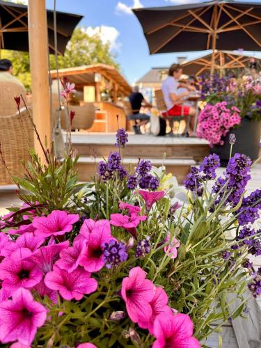 a bouquet of pink flowers sitting on a table at Wiks Slott in Vik