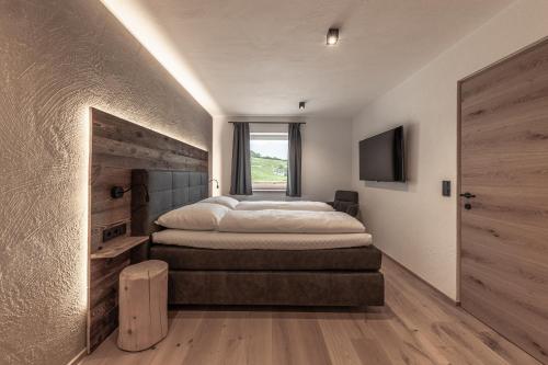 Ένα ή περισσότερα κρεβάτια σε δωμάτιο στο Moarhof - Apartments and moar