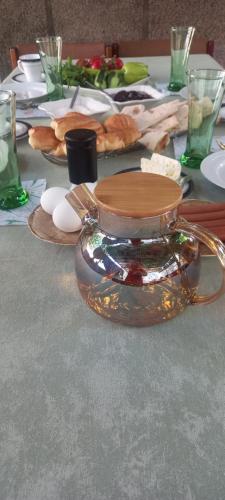 a table with a plate of food and a bowl of food at Hause of Ashot in Dilijan