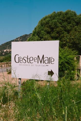 a sign for a cheese market with a hill in the background at Creste E Mare in Ajaccio