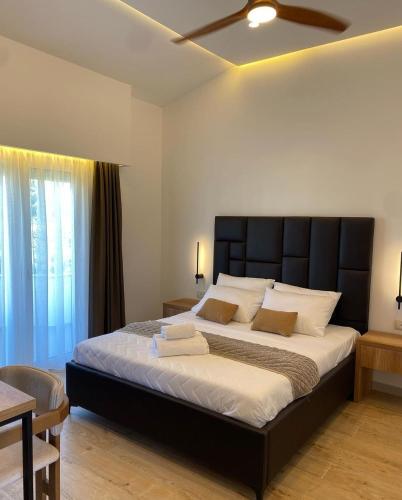 Ένα ή περισσότερα κρεβάτια σε δωμάτιο στο Hotel Comfort & Villas
